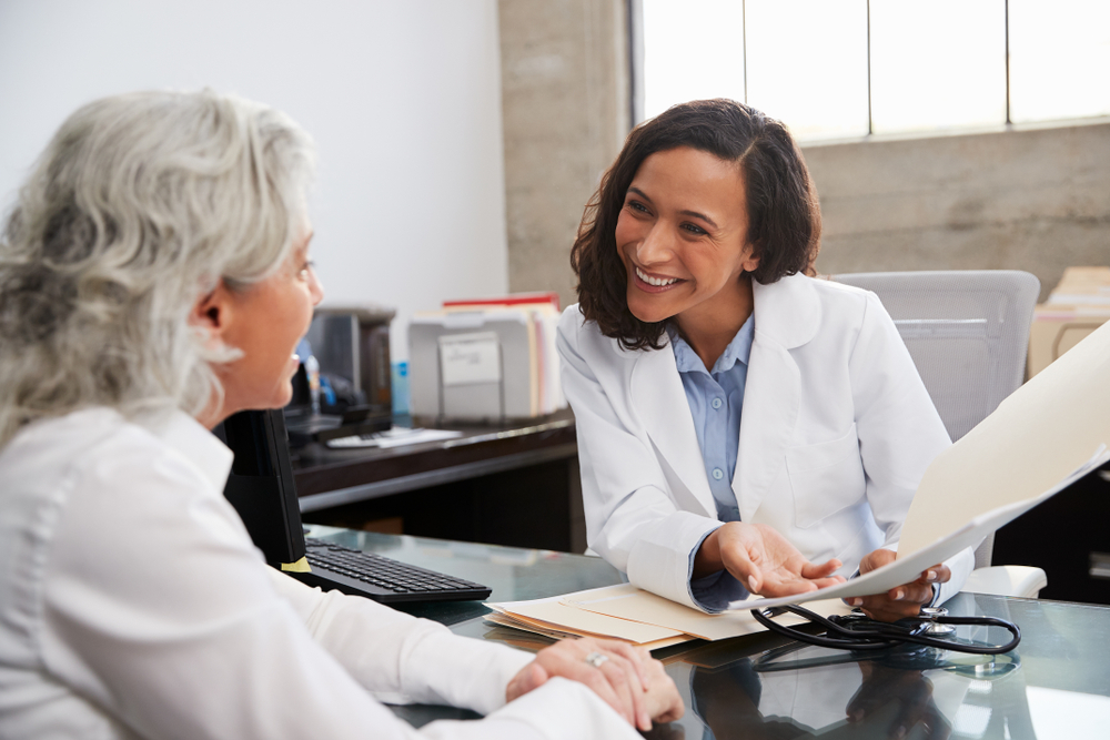 doctor talking with older woman