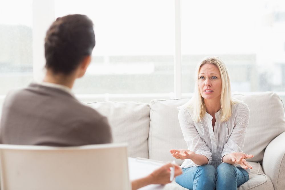 Woman talking to a therapist and being turned away